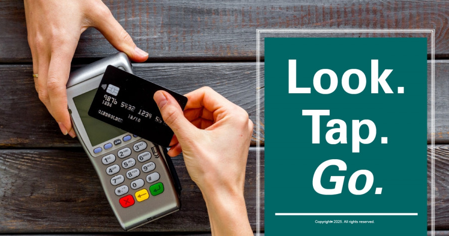 Retail store with OPEN/VISA sign in window.